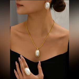 Necklace, earrings, and ring pearl set.